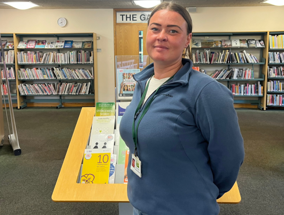 Rae-Anne Preece, Lead Youth Worker for the Detached Project standing in Droitwich Library during Libraries Unlocked hours. 