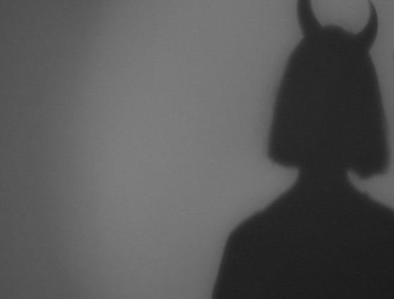 Shadow of a devil figure