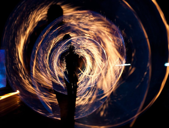 Silhouette of person spinning a sparkler