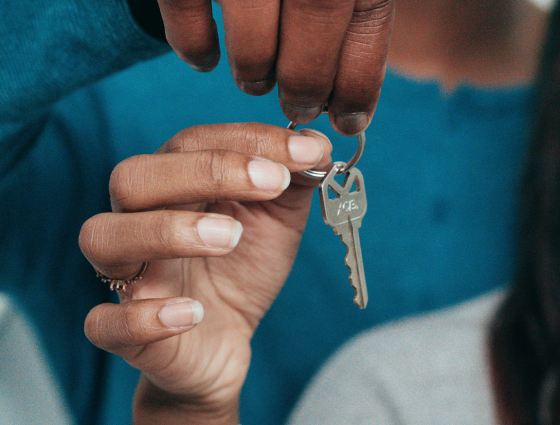 Close up of a hand holding a key