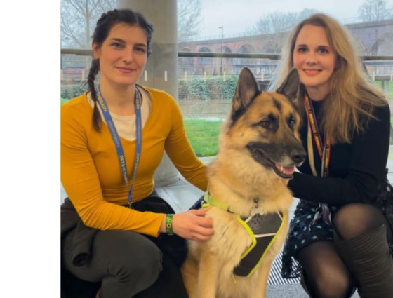 Lupin, a Pets As Therapy dog, his owner Amanda and Gemma at The Hive