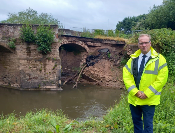 Marc Bayliss, standing in front of Powick Old Bridge