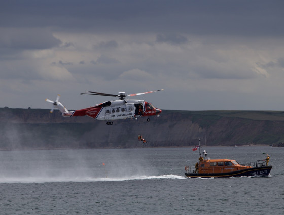 Image of a coastguard helicopter and lifeboat at sea