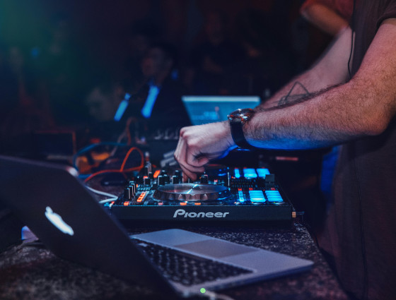 Image of a person using DJ decks