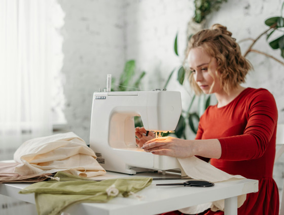 Image of a woman using a sewing machine