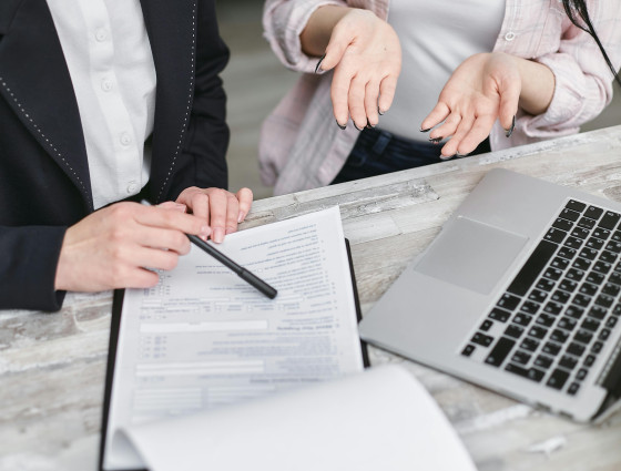 Image of two people looking over important documents