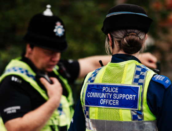 Image of a police officer and a community support officer