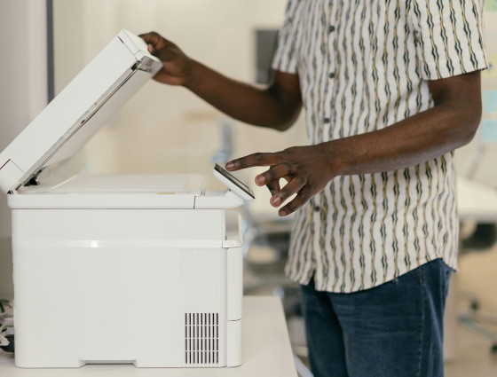 Image of a person using a photocopier