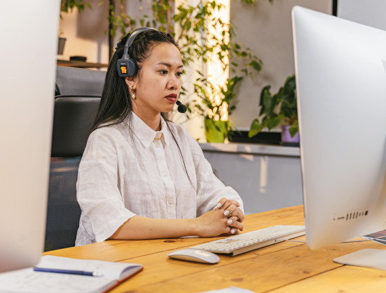 Image of a person wearing a telephone headset