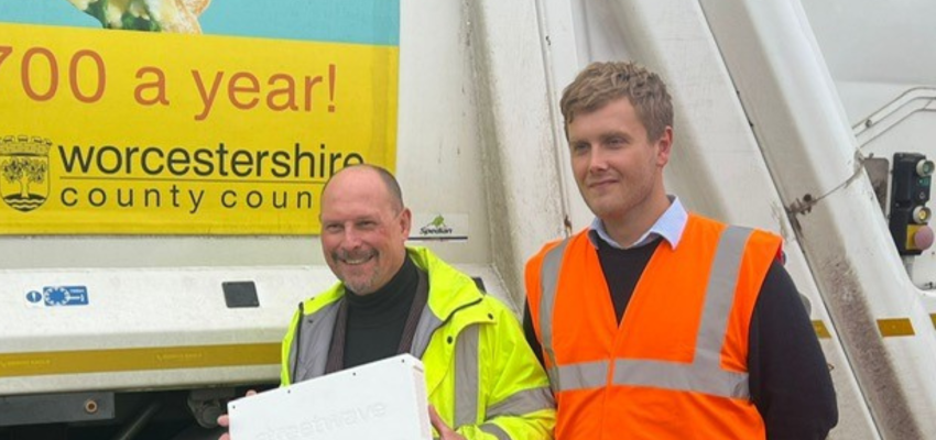 Adam Kent and Henry Rutland pose with the devices that will be fitted to bin lorries to help track mobile connectivity