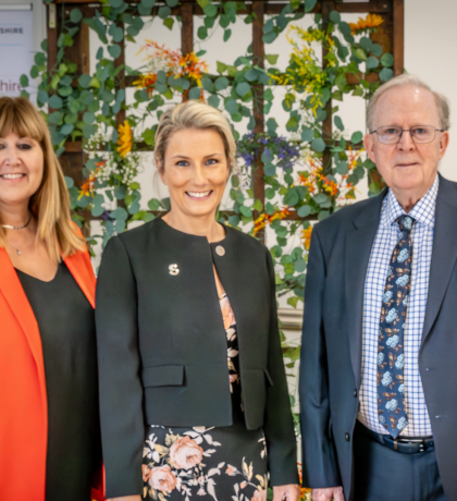 A photograph of Michelle Dowse, Lynette Barrett and Cllr David Chambers outside the new building