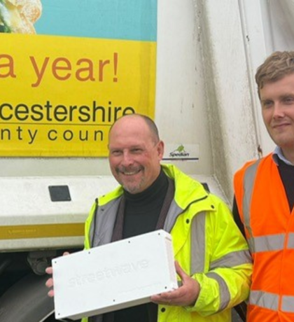 Adam Kent and Henry Rutland pose with the devices that will be fitted to bin lorries to help track mobile connectivity