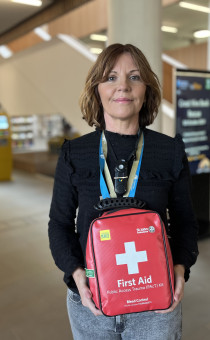 Lady holding a trauma kit at the Hive