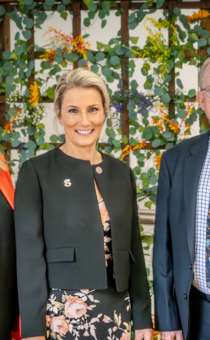 A photograph of Michelle Dowse, Lynette Barrett and Cllr David Chambers outside the new building