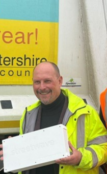 Adam Kent and Henry Rutland pose with the devices that will be fitted to bin lorries to help track mobile connectivity